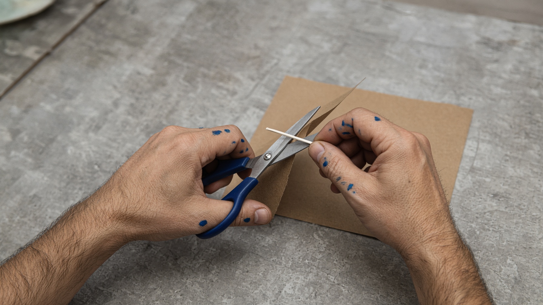 Cut paper with scissors.